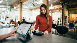 A woman purchases with a credit card