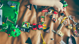 Toys scattered on a brown rug