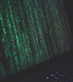 Green code on computer screen