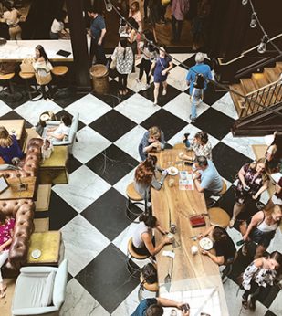 People sitting down to coffee