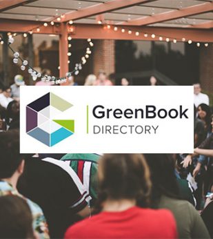 group of people outside with greenbook logo