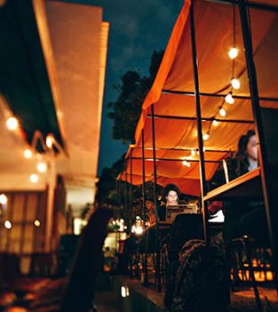 People working at outdoor cafe