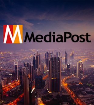 Media Post logo overlayed on a city at dusk