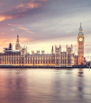 A view of Palace of Westminster from the river at sunset.