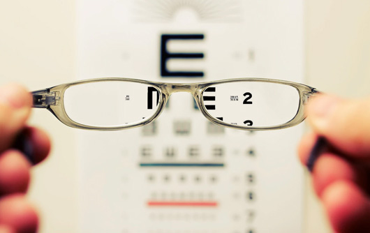 View of an eye exam through a pair of glasses