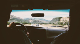 View of a road trip from inside the car.