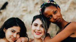 three women post together
