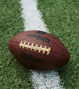 A football sits on a field