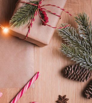 A wrapped gift and other Christmas-themed items