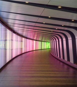 A windy hallway with colored lights