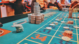 Chips sit on a roulette table