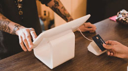 A person pays for an order with a credit card