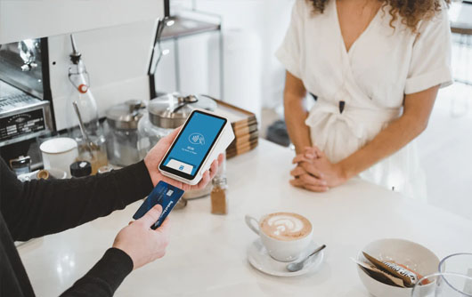 A person pays for an order with a credit card