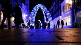 An outdoor light installment on a street at night