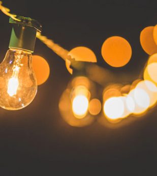 String lights hanging against a dark background